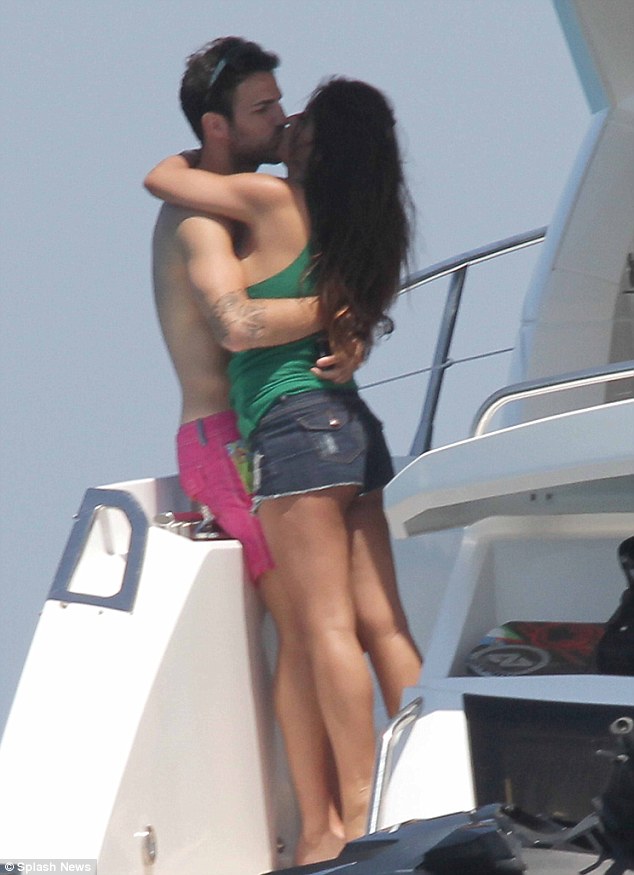 Footballer Cesc Fabregas kisses girlfriend on luxury yacht vacation with family in ibiza in july
