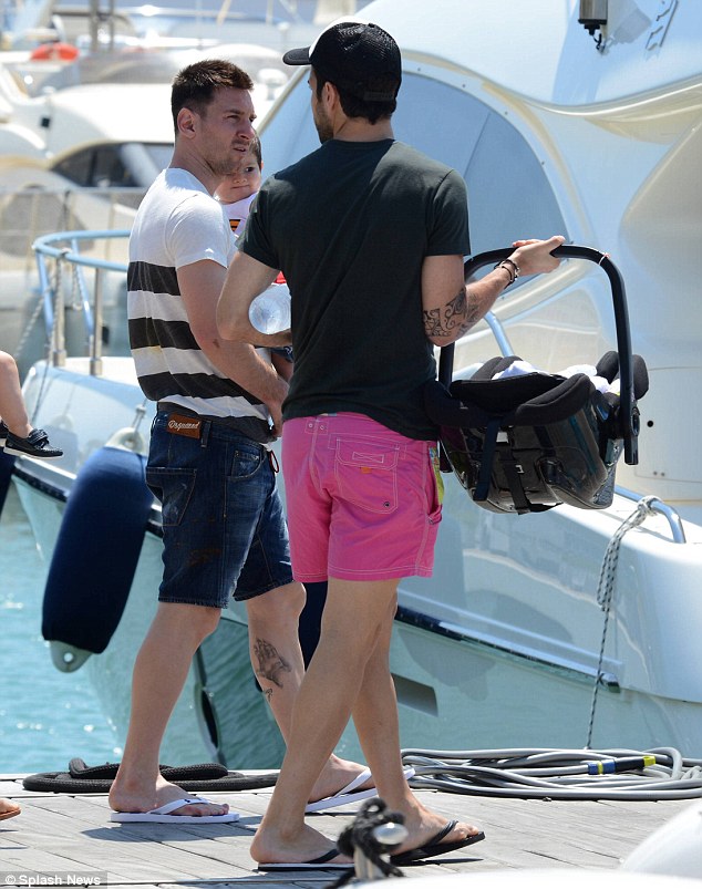 Footballers Lionel Messi and Cesc Fabregas on board luxury yacht with family in ibiza in july