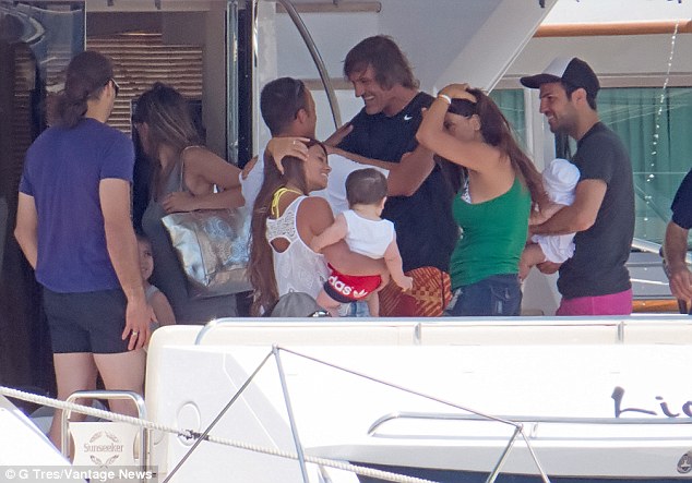 Footballers Lionel Messi and Cesc Fabregas on board luxury yacht with family in ibiza in july
