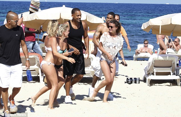 will smith surrounded by fans in ibiza