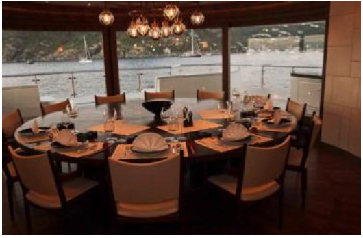 dining room with great views from large windows on board Steven Spielberg's luxury yacht Seven Seas