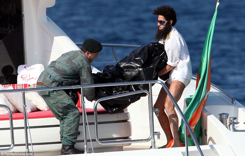 Sacha Baron Cohen pretends to throw Elisabetta Canali off luxury yacht as 'the dictator' for cannes film festival