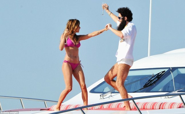 Sacha Baron Cohen on board luxury yacht with Elisabetta Canali as 'the dictator' for cannes film festival