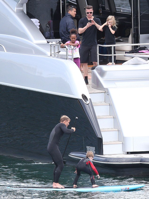 Brad Pitt and kids watch know paddleboard on luxury yacht ghost in sydney