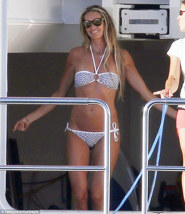 elle macpherson on board superyacht MADSUMMER in sardinia on vacation with husband