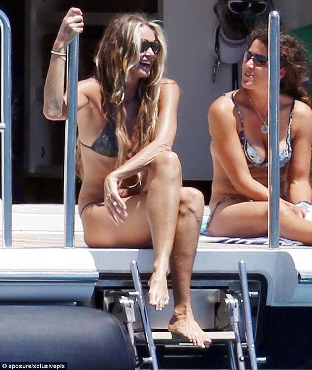 elle macpherson chatting with friend on board superyacht MADSUMMER 