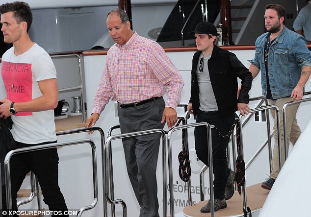 hunger games star Josh Hutchers  leaves luxury yacht la dea II in cannes