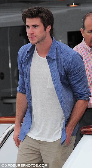 hunger games star Liam Hemsworth leaves luxury yacht la dea II in cannes