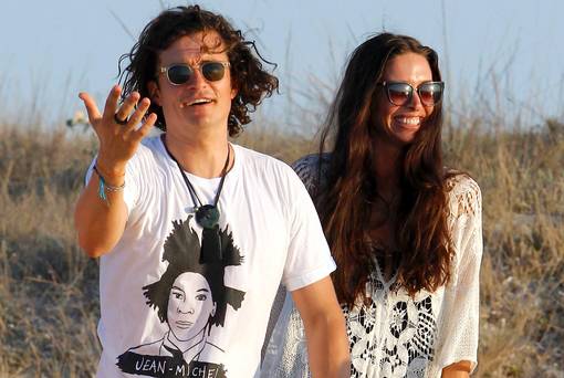 orlando bloom with erica packer on ibiza beach on way to superyacht SEAHORSE