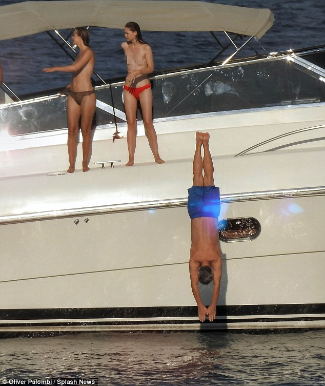 eddie dives off superyacht diversion as topless women watch