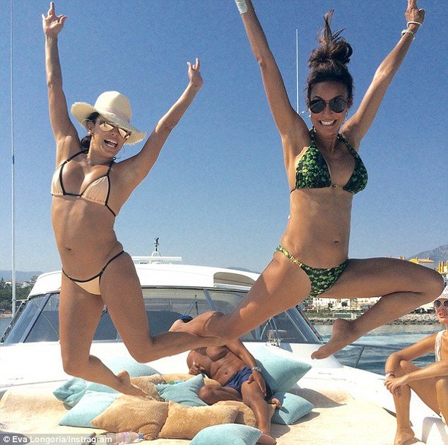 eva longaria jumps in air with friend on luxury yacht in marbella
