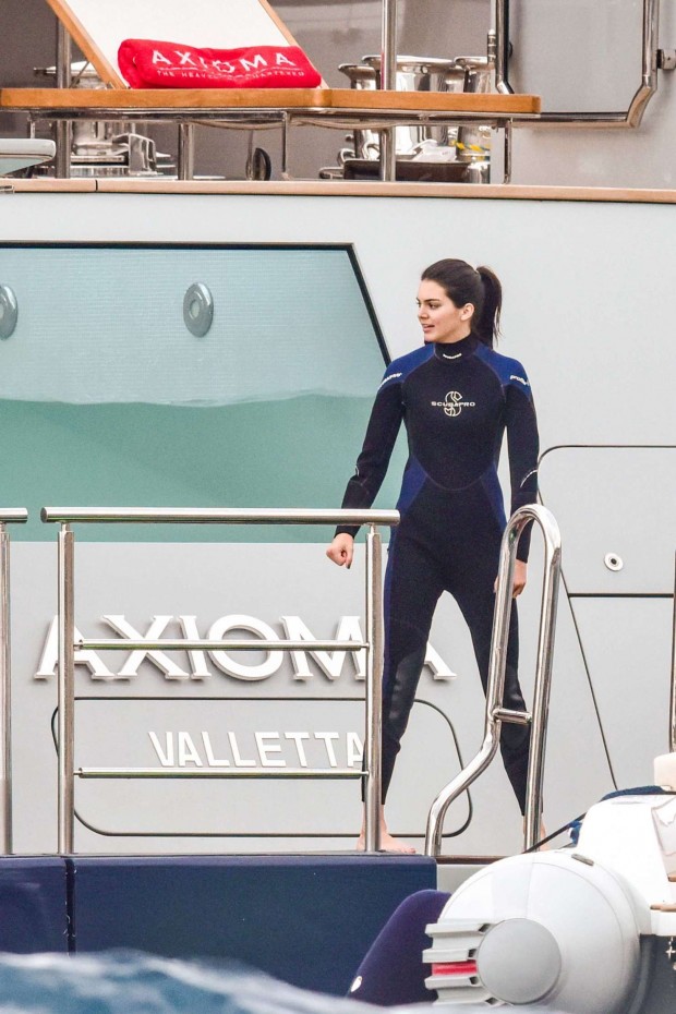 kendall jenner gets ready to get on superyacht axioma's jet-ski
