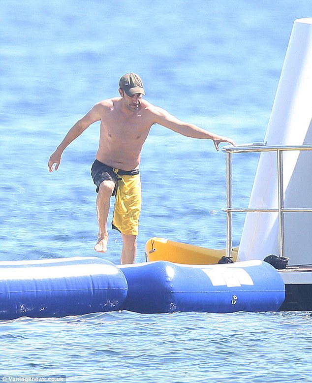 sacha baron cohen tries out inflatable watertoy on bono's superyacht 'kingdom come'